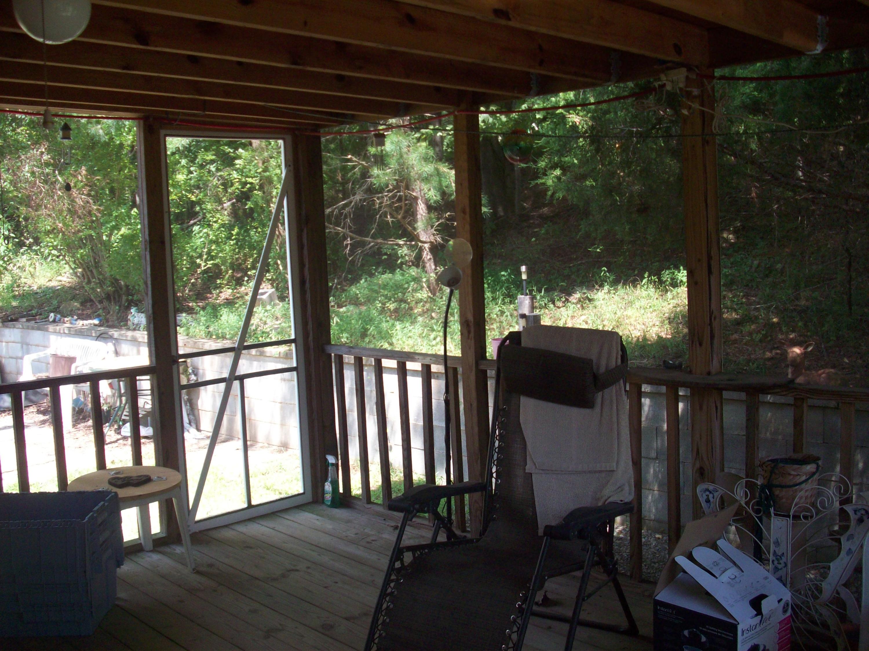 205 Board Mountain Road Goodview, VA 24095 - Photo 16 of 17 a view of a porch with furniture and backyard