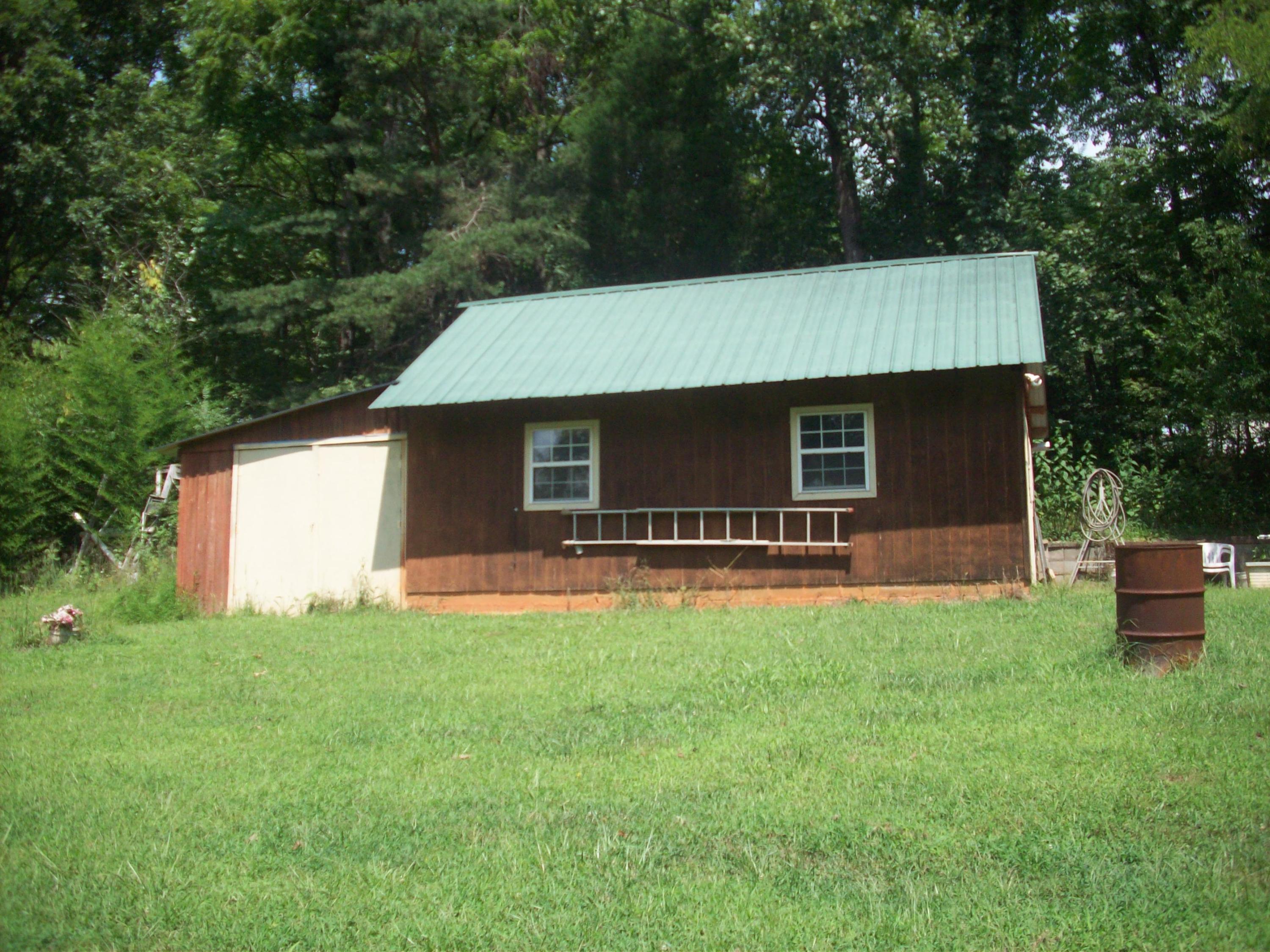205 Board Mountain Road Goodview, VA 24095 - Photo 17 of 17 a front view of house with yard and green space