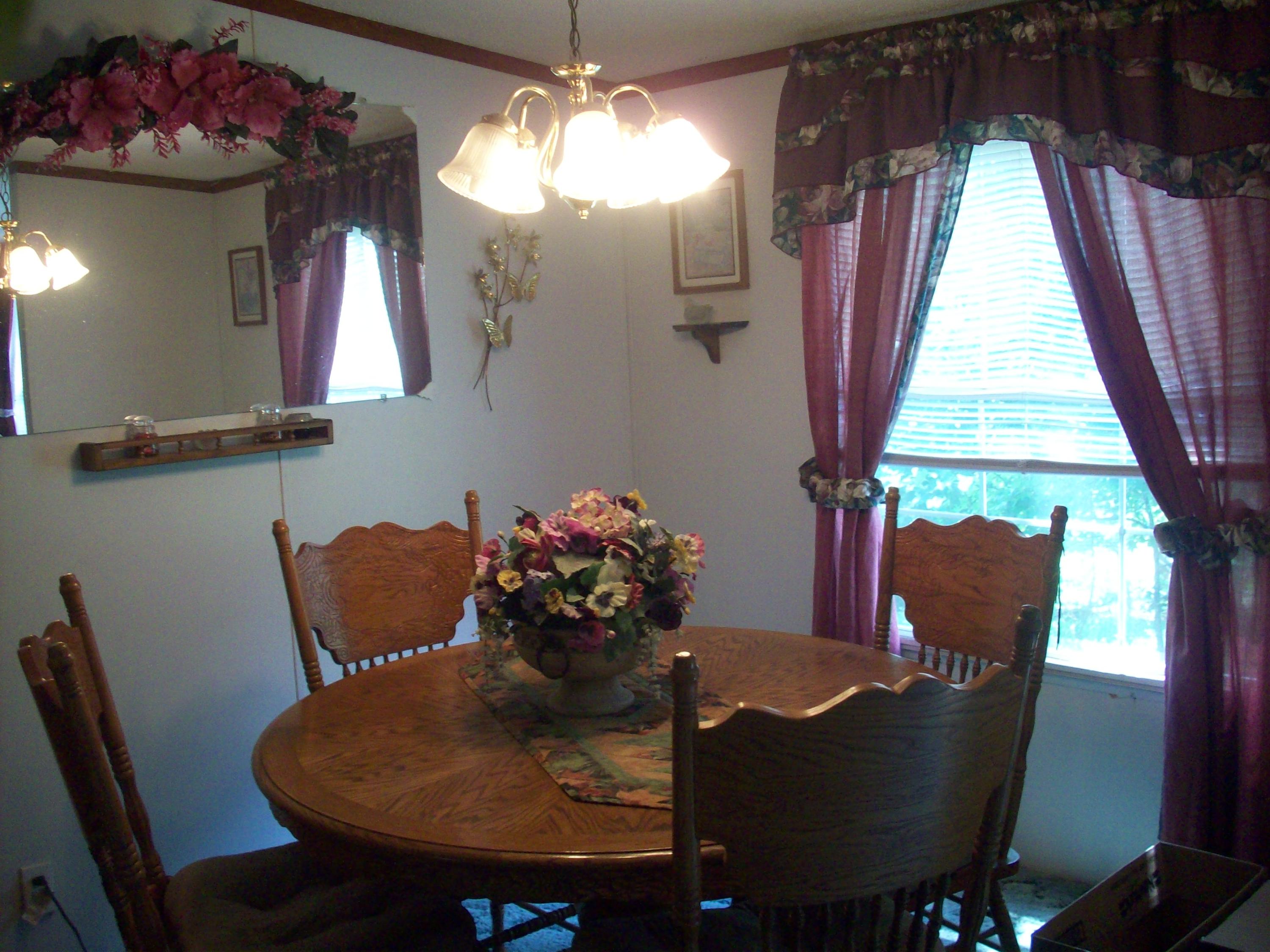 205 Board Mountain Road Goodview, VA 24095 - Photo 10 of 17 a view of a dining room with furniture and window