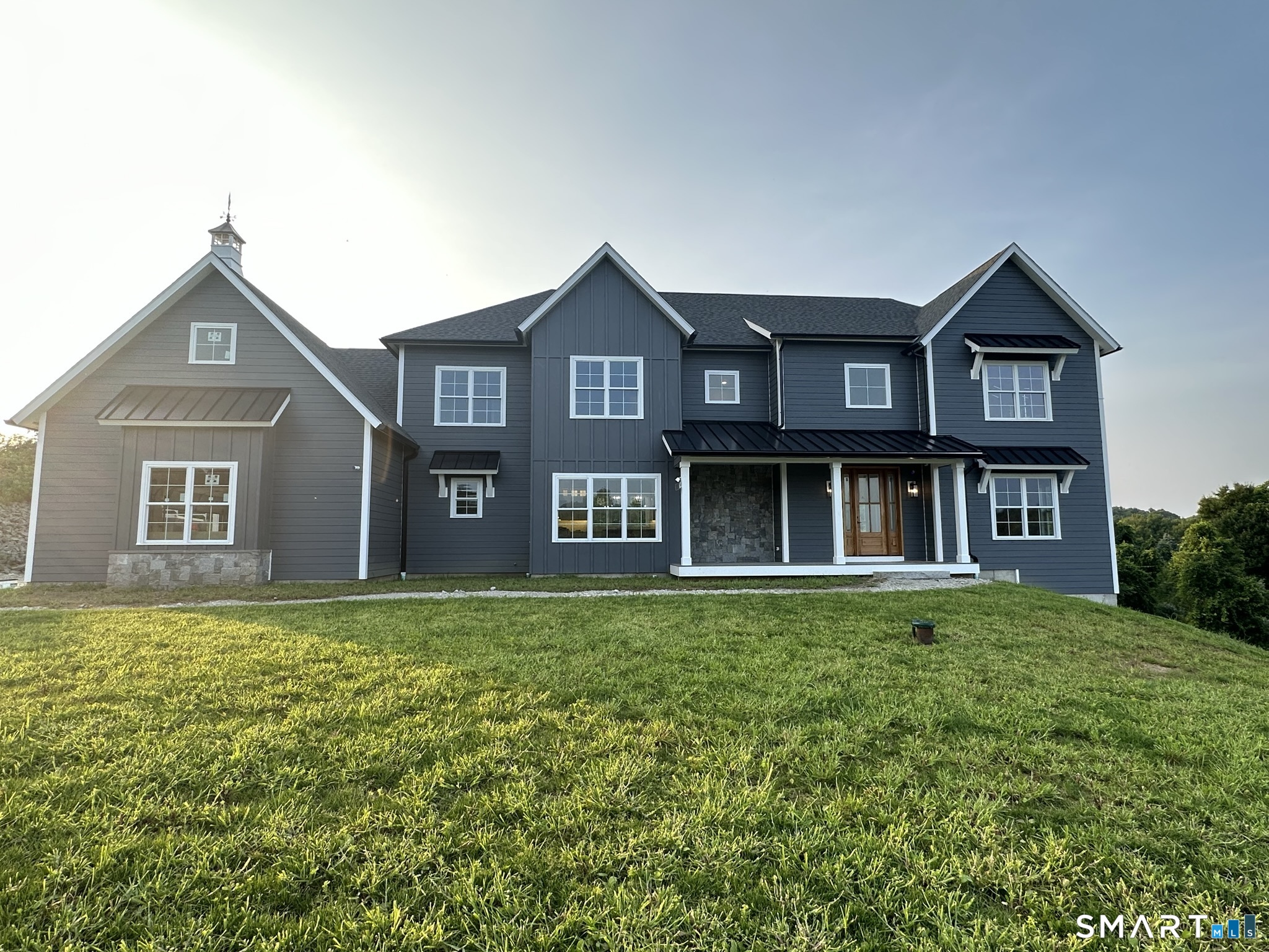 8 Stone Bridge Trail Newtown, CT 06482 - Photo 2 of 6 a front view of a house with garden