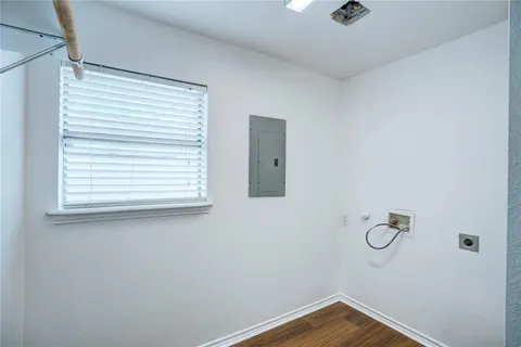 a bathroom with a window and mirror