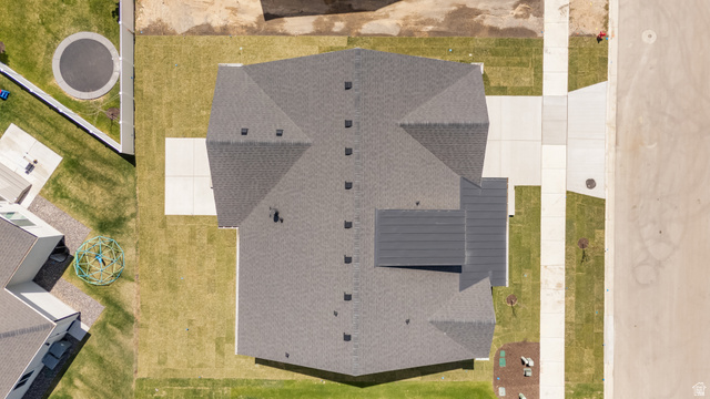 43 South Crimson Way, Unit 311 Mapleton, UT 84664 - Photo 28 of 28 Gabled roofline property featuring a dark shingle roof, concrete driveway, and front sidewalk