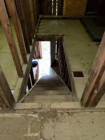 a room with furniture and gym equipment