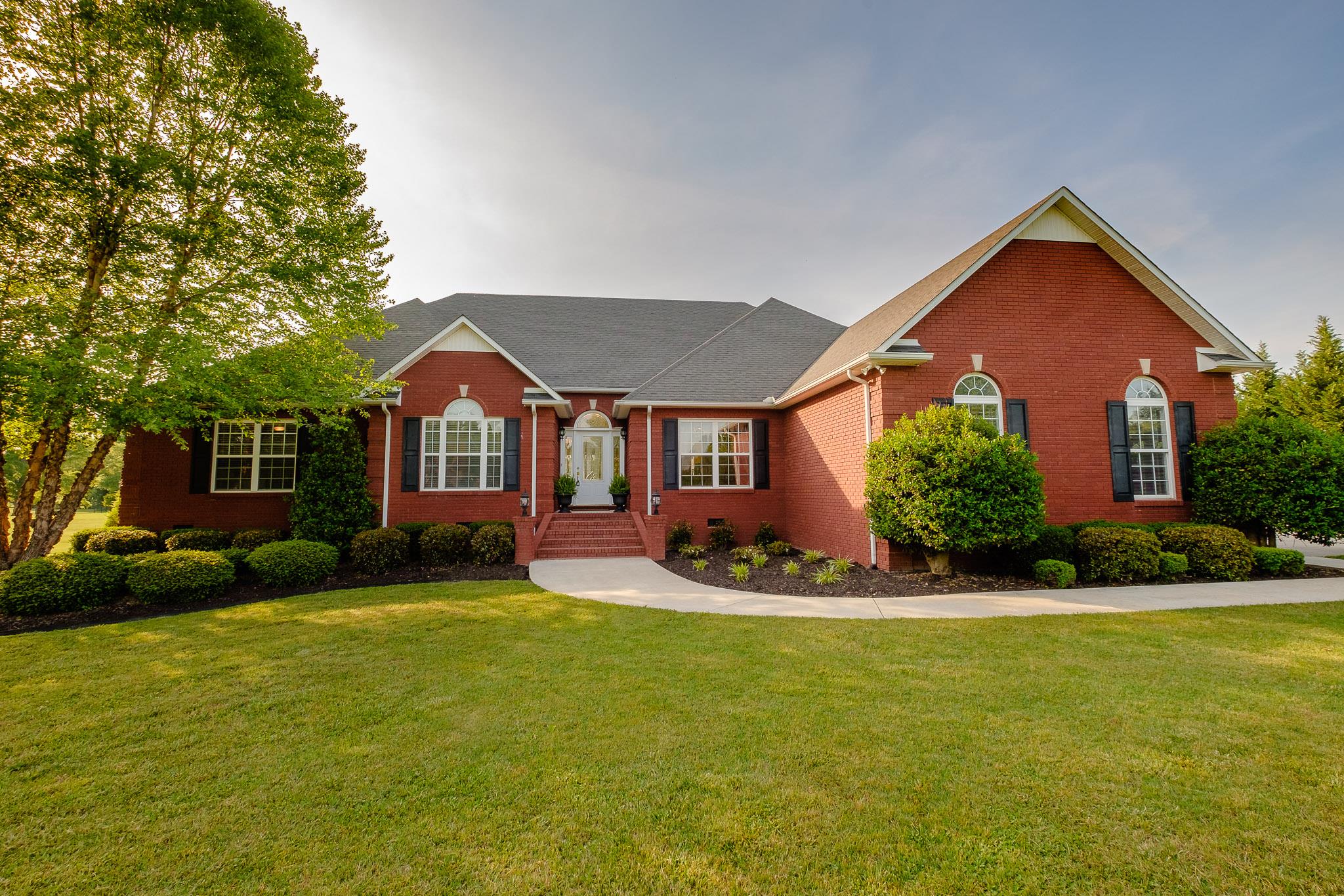 329 Urban Farms Road Manchester, TN 37355 - Photo 2 of 29 a front view of a house with garden