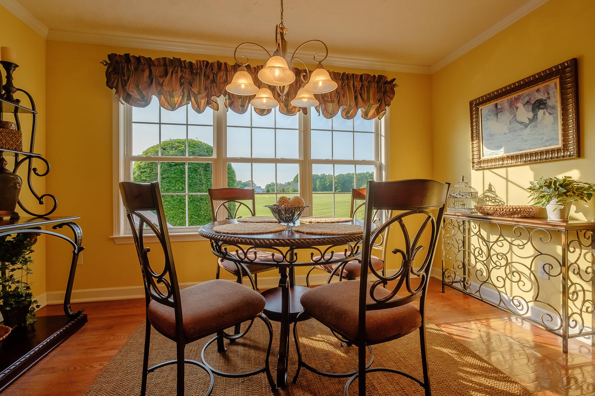 329 Urban Farms Road Manchester, TN 37355 - Photo 15 of 29 a dining room with furniture and a chandelier