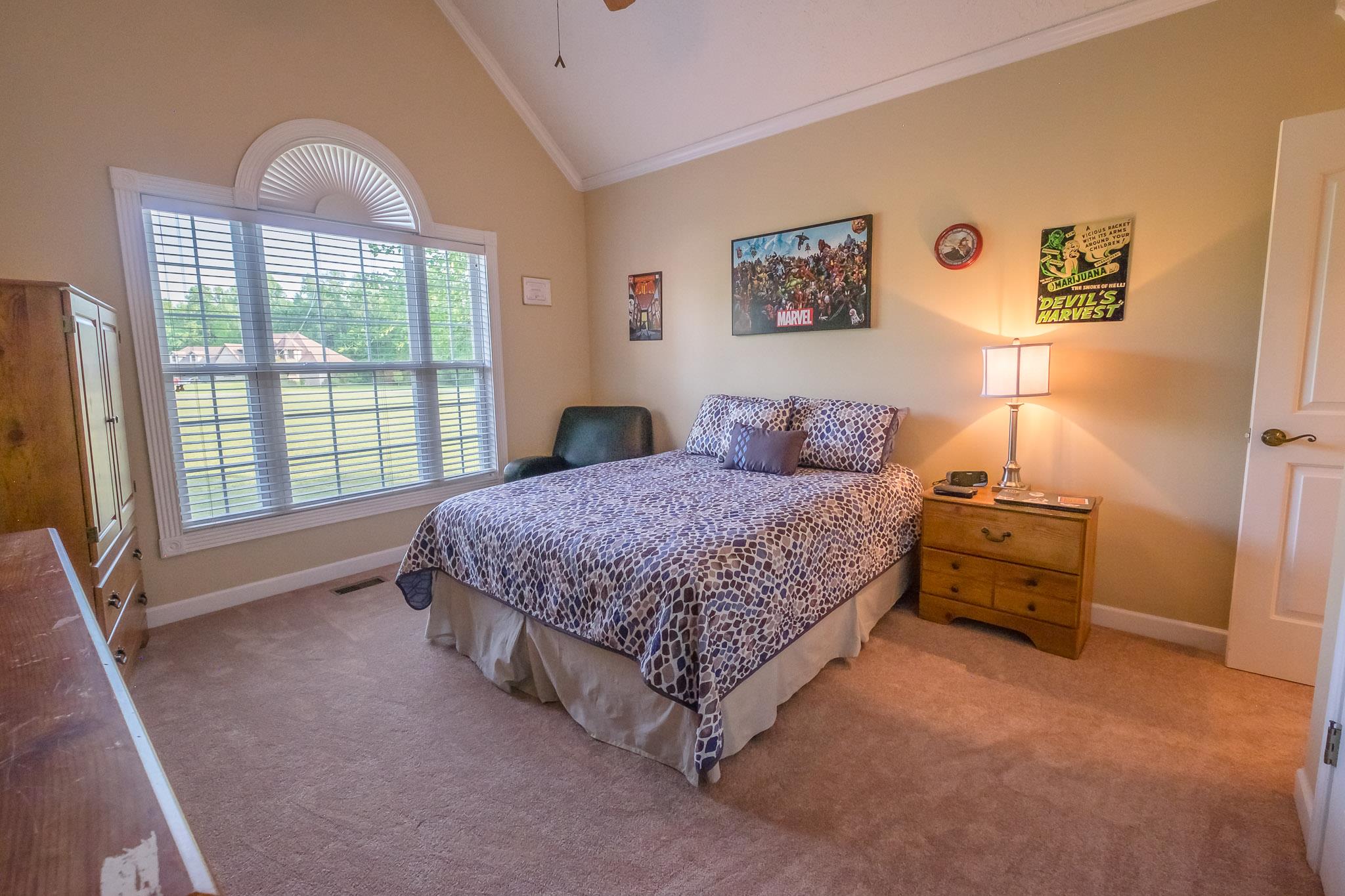 329 Urban Farms Road Manchester, TN 37355 - Photo 22 of 29 a bedroom with a bed and a dresser next to a window
