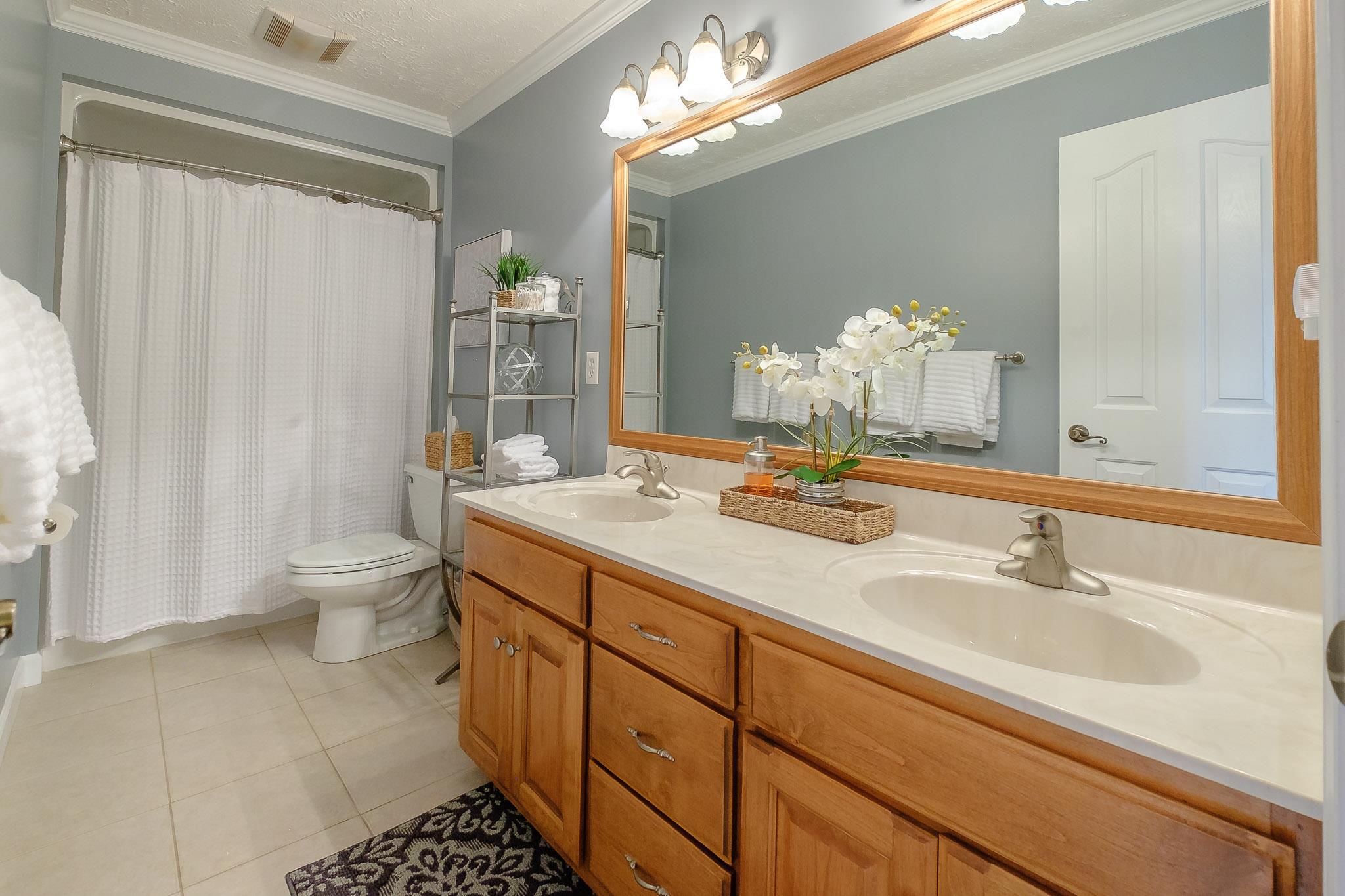 329 Urban Farms Road Manchester, TN 37355 - Photo 25 of 29 a bathroom with a double vanity sink mirror and toilet