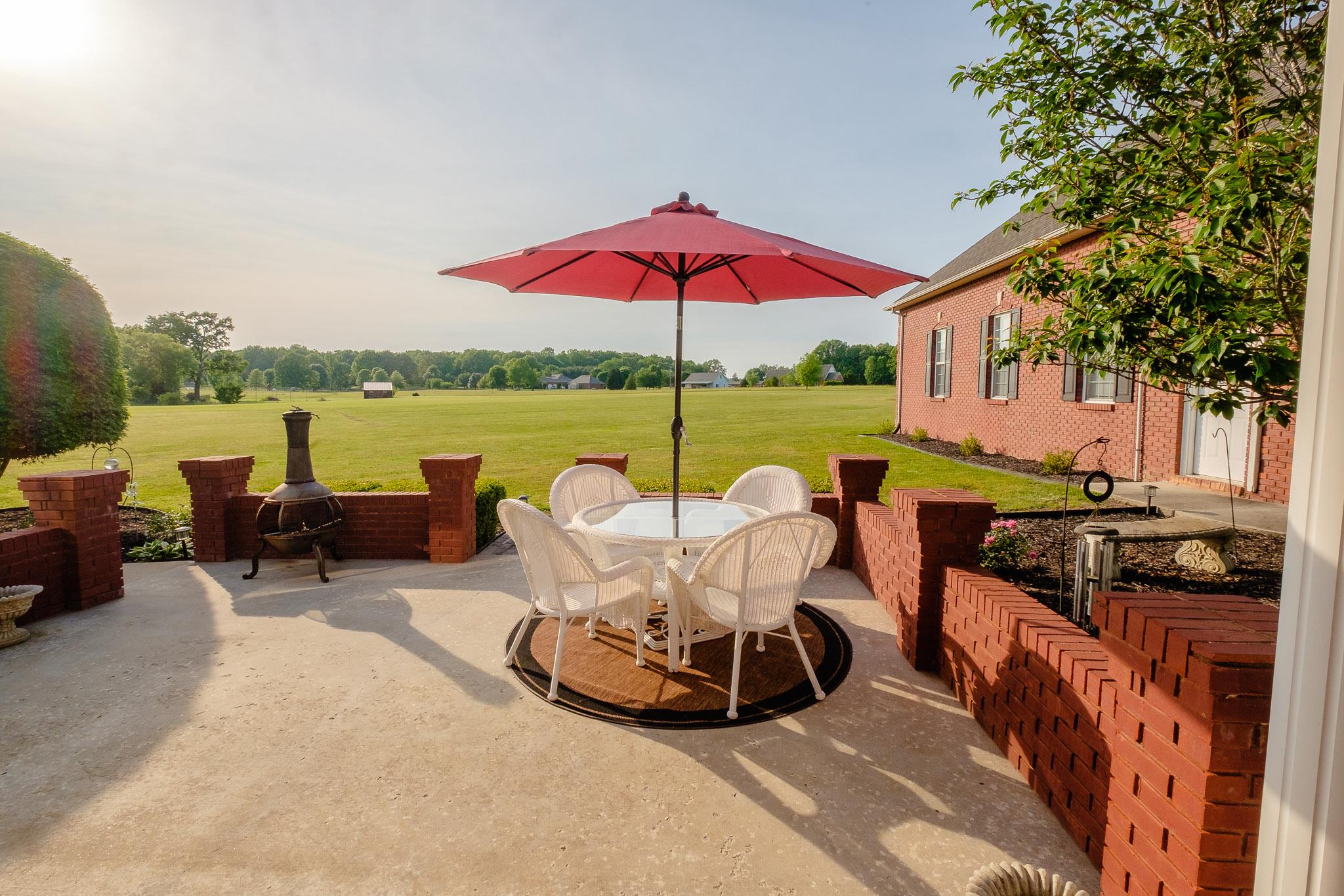 329 Urban Farms Road Manchester, TN 37355 - Photo 28 of 29 a view of a table and chairs on the roof deck