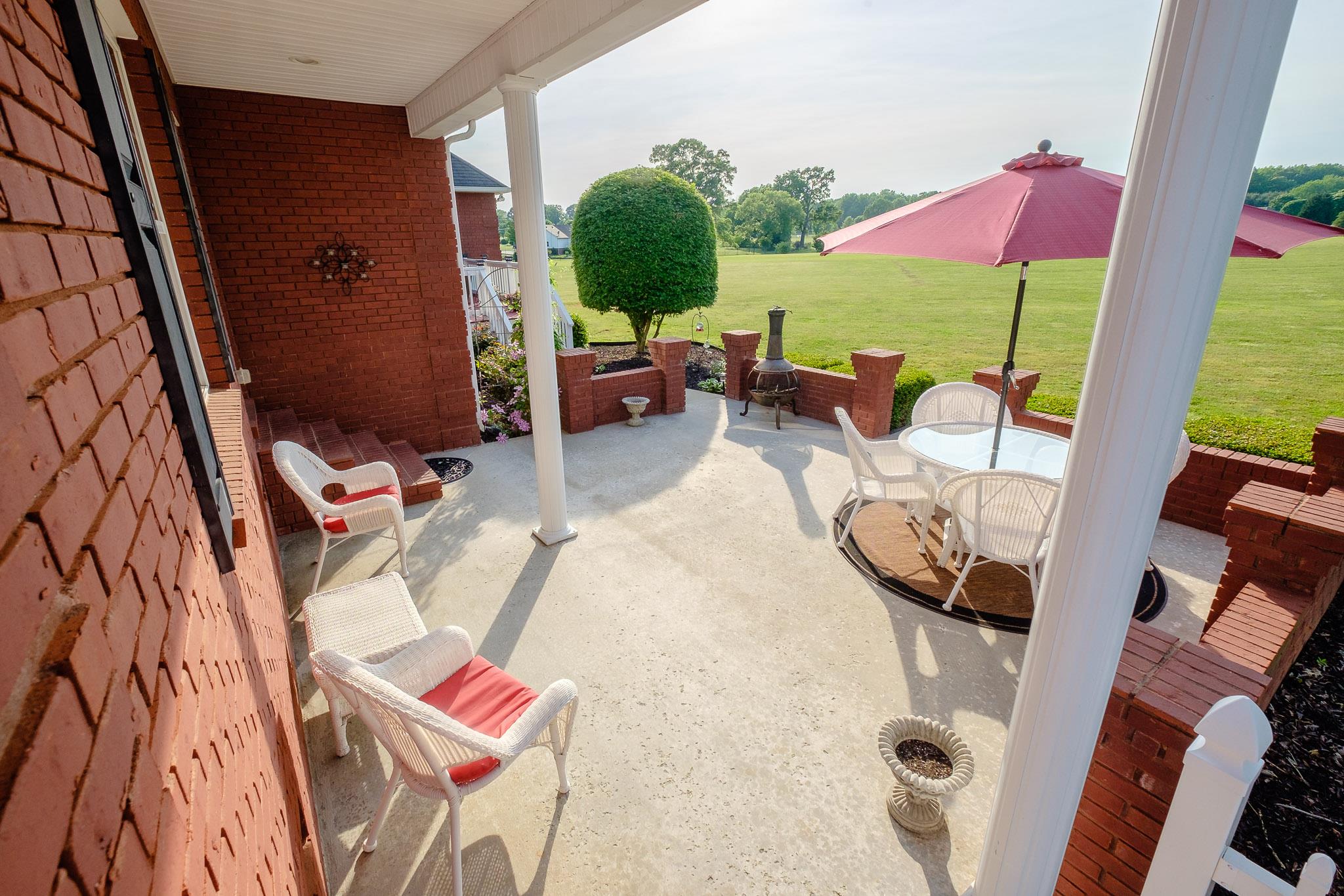 329 Urban Farms Road Manchester, TN 37355 - Photo 29 of 29 a view of balcony with furniture and a garden