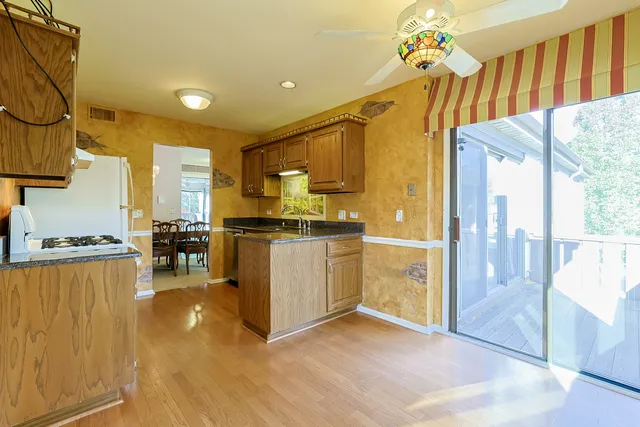 a kitchen that has a lot of cabinets in it