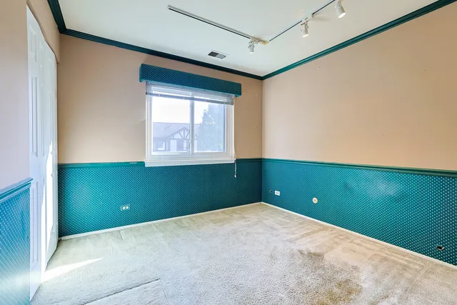 a view of a room that has windows