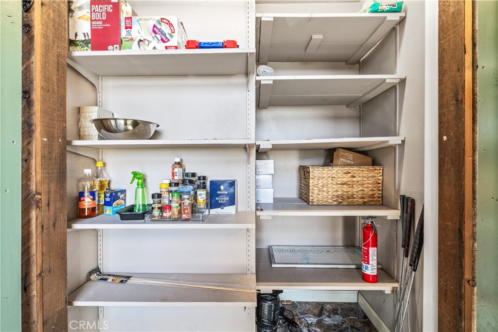 2178 Ridge Rider Road Bradley, CA 93426 - Photo 17 of 51 a utility room with lots of clutter and cabinets