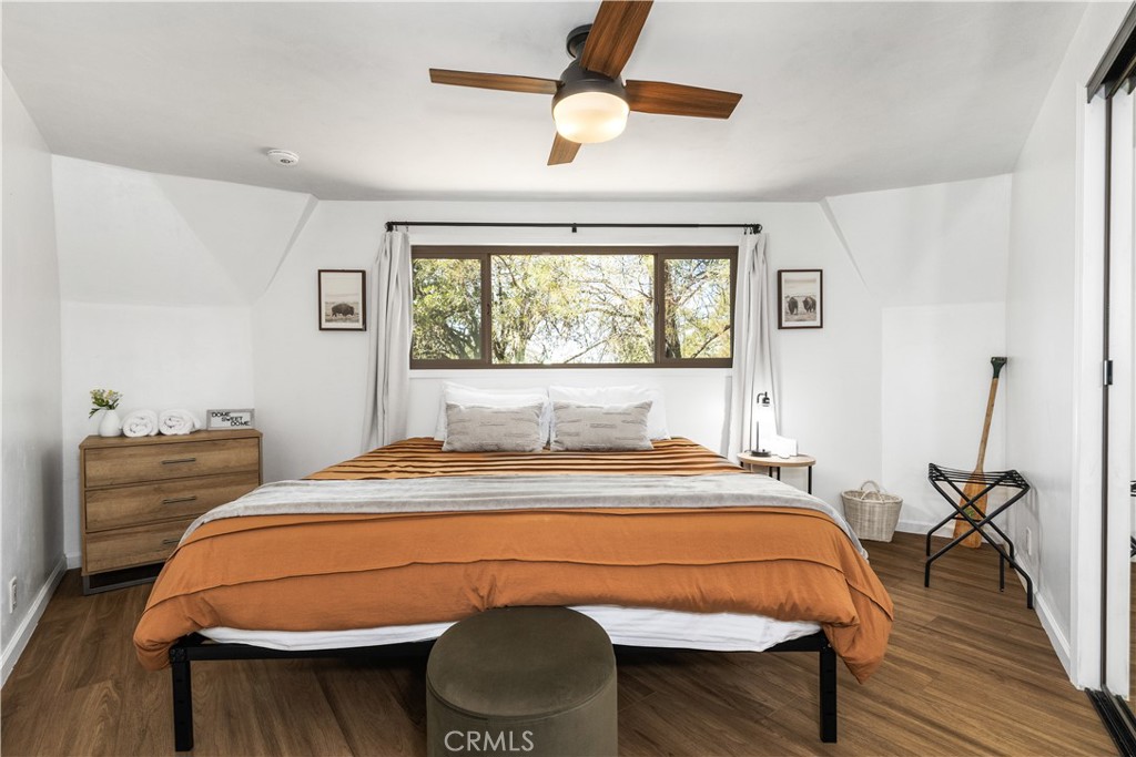 2178 Ridge Rider Road Bradley, CA 93426 - Photo 18 of 51 a bedroom with a bed and a chandelier