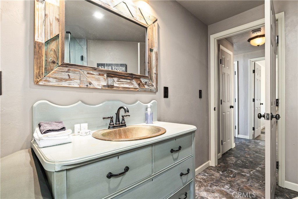2178 Ridge Rider Road Bradley, CA 93426 - Photo 22 of 51 a bathroom with a sink and a mirror
