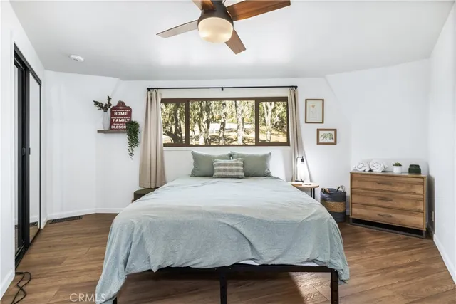 a spacious bedroom with a bed and a window
