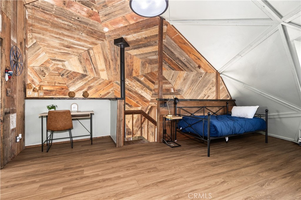 2178 Ridge Rider Road Bradley, CA 93426 - Photo 26 of 51 a bedroom with a bed a desk and chair with wooden floor