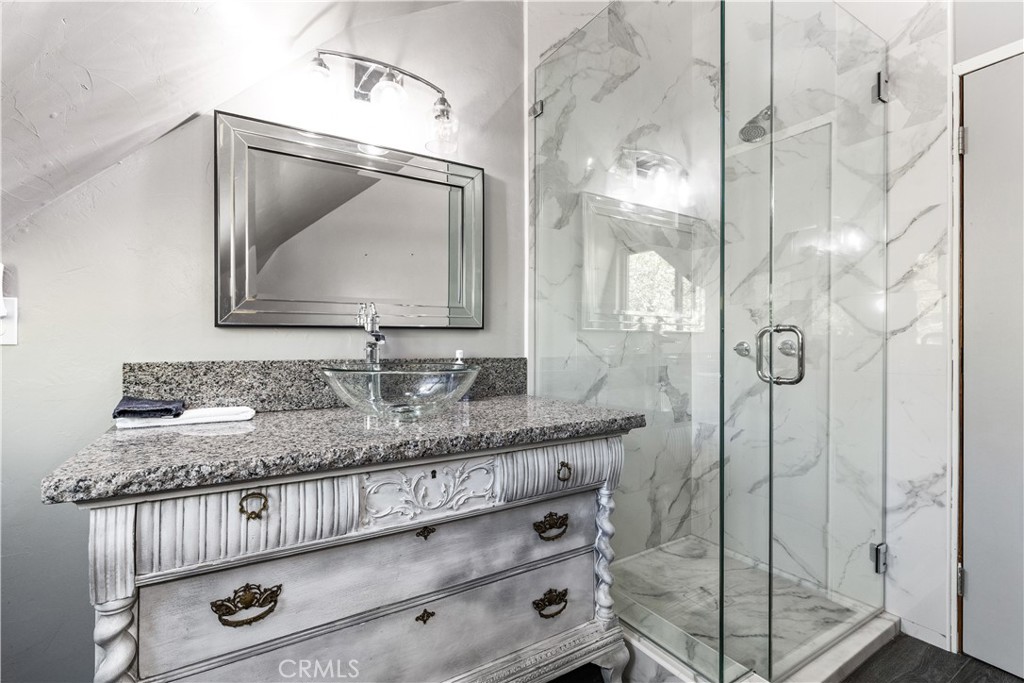 2178 Ridge Rider Road Bradley, CA 93426 - Photo 28 of 51 a bathroom with a granite countertop sink a mirror and shower