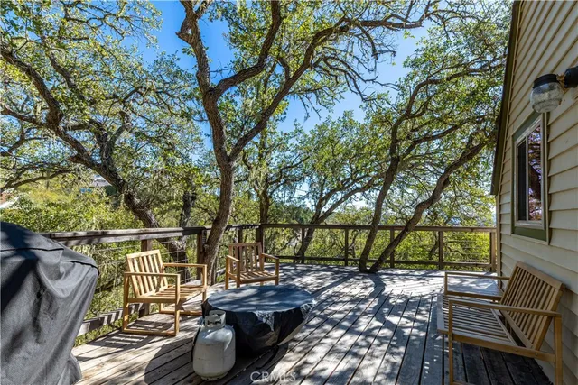 a view of balcony with couch and chairs
