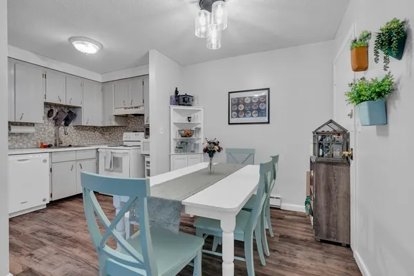 a view of kitchen with cabinets and wooden floor