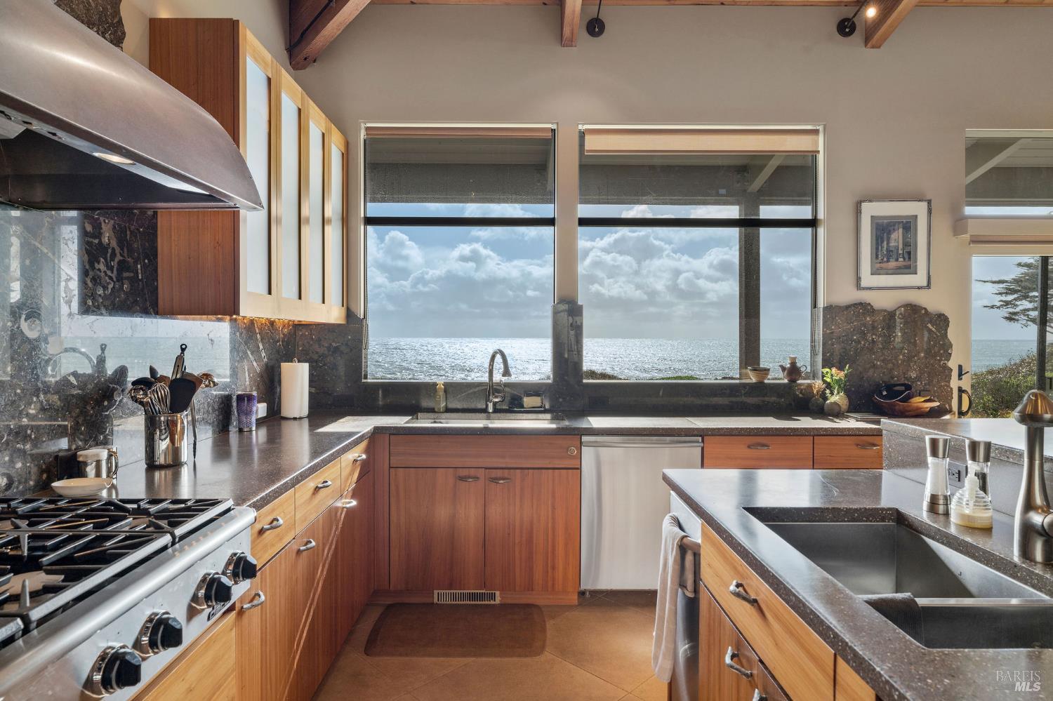 40445 Tide Pool The Sea Ranch, CA 95497 - Photo 16 of 75 a kitchen with a sink a counter and cabinets