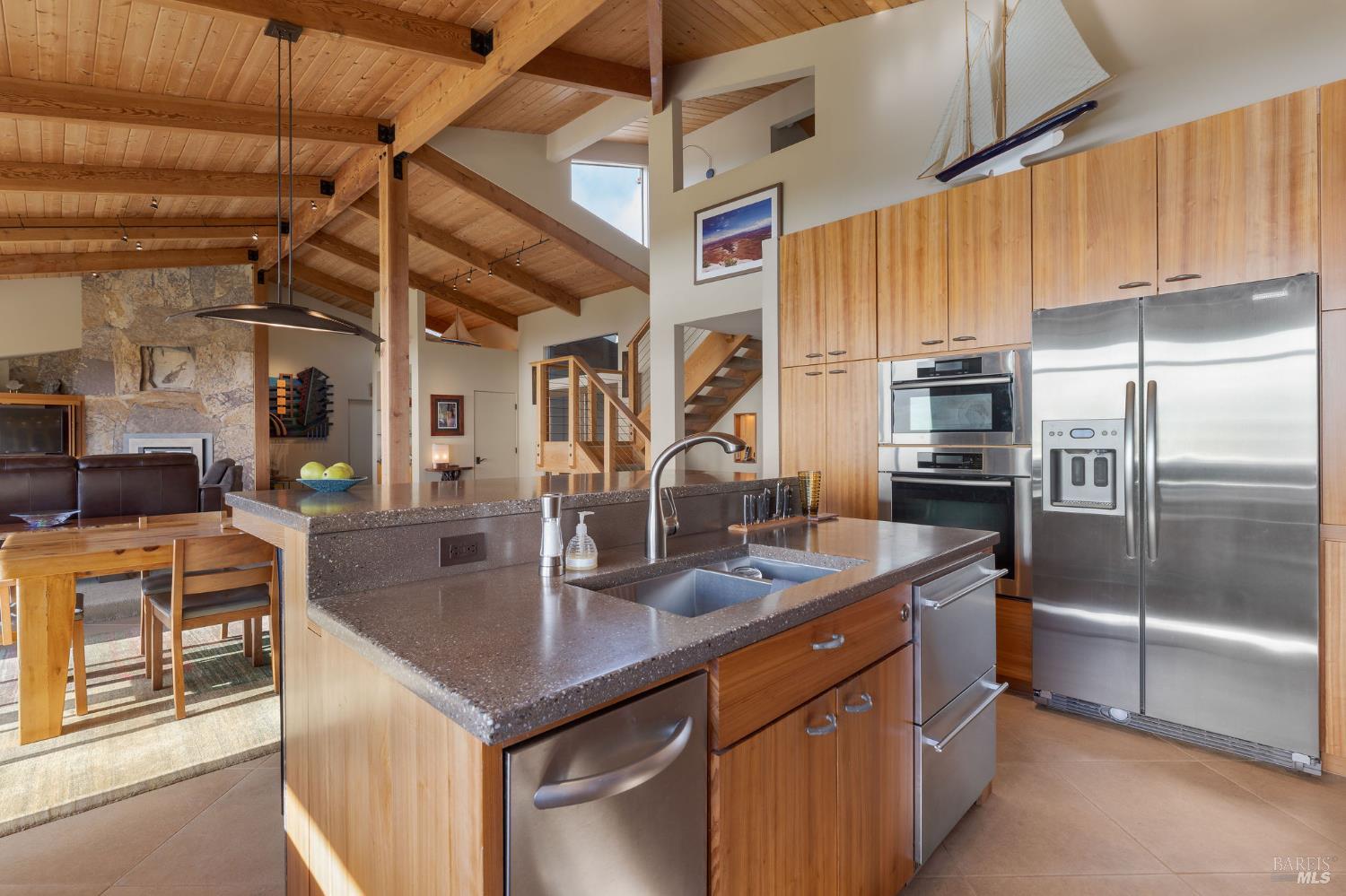 40445 Tide Pool The Sea Ranch, CA 95497 - Photo 19 of 75 a kitchen with stainless steel appliances granite countertop a sink a refrigerator and a counter top space