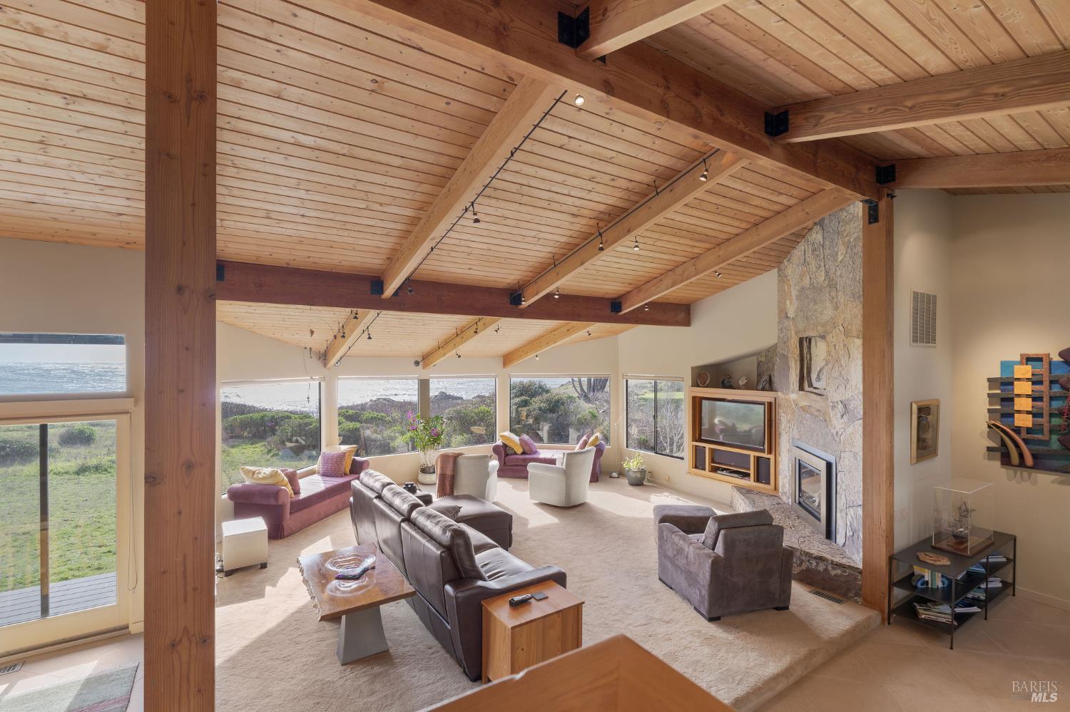 40445 Tide Pool The Sea Ranch, CA 95497 - Photo 25 of 75 a living room with furniture a rug and a large window