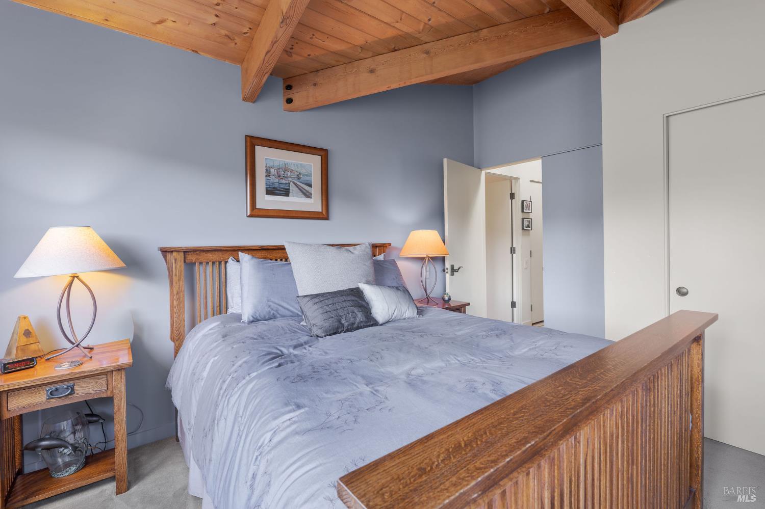 40445 Tide Pool The Sea Ranch, CA 95497 - Photo 39 of 75 a bedroom with a bed and a potted plant