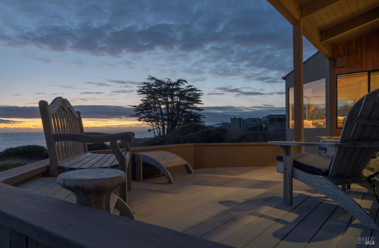 40445 Tide Pool The Sea Ranch, CA 95497 - Photo 4 of 75 a roof deck with table and chairs couches with wooden floor and fence