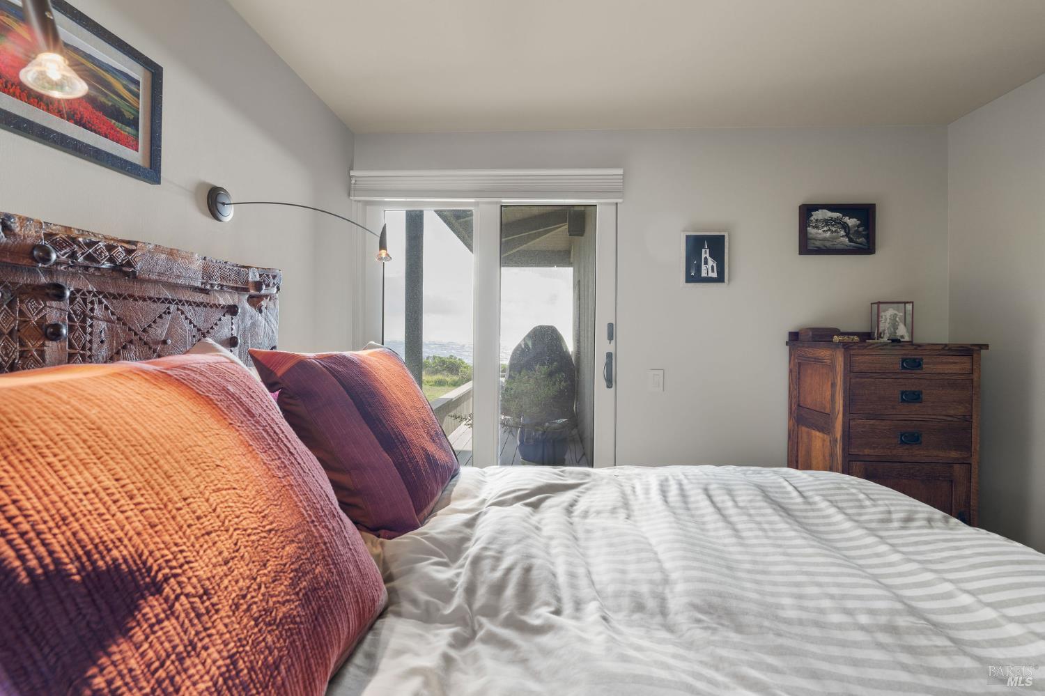 40445 Tide Pool The Sea Ranch, CA 95497 - Photo 47 of 75 a bedroom with a bed and a dresser