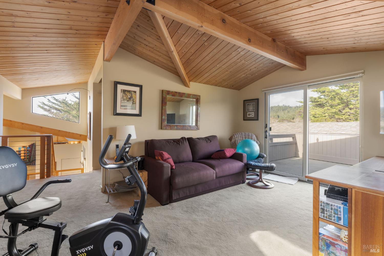 40445 Tide Pool The Sea Ranch, CA 95497 - Photo 52 of 75 a living room with furniture a flat screen tv and a large window