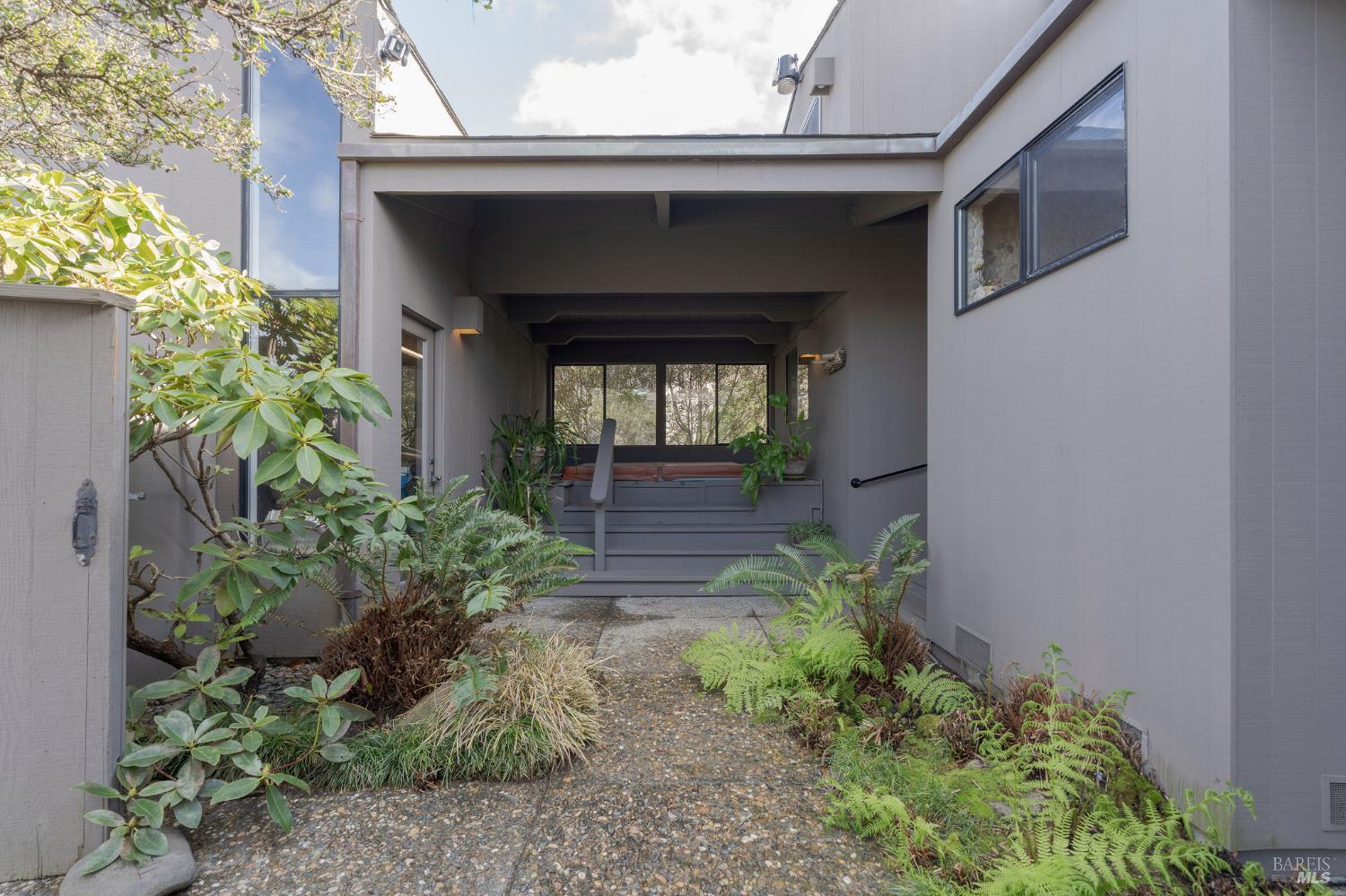 40445 Tide Pool The Sea Ranch, CA 95497 - Photo 58 of 75 a front view of a house with a yard