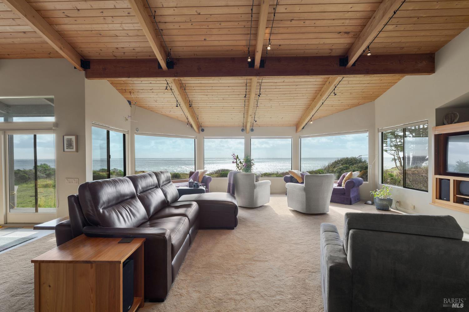 40445 Tide Pool The Sea Ranch, CA 95497 - Photo 6 of 75 a living room with furniture and three large trees