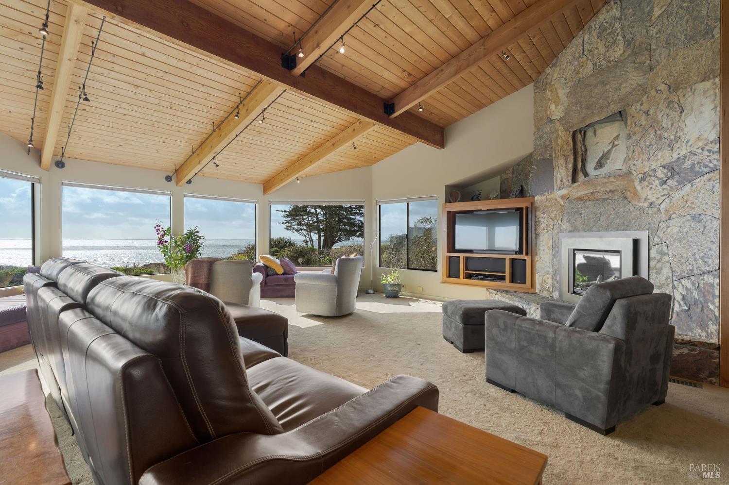 40445 Tide Pool The Sea Ranch, CA 95497 - Photo 9 of 75 a living room with furniture and a fireplace