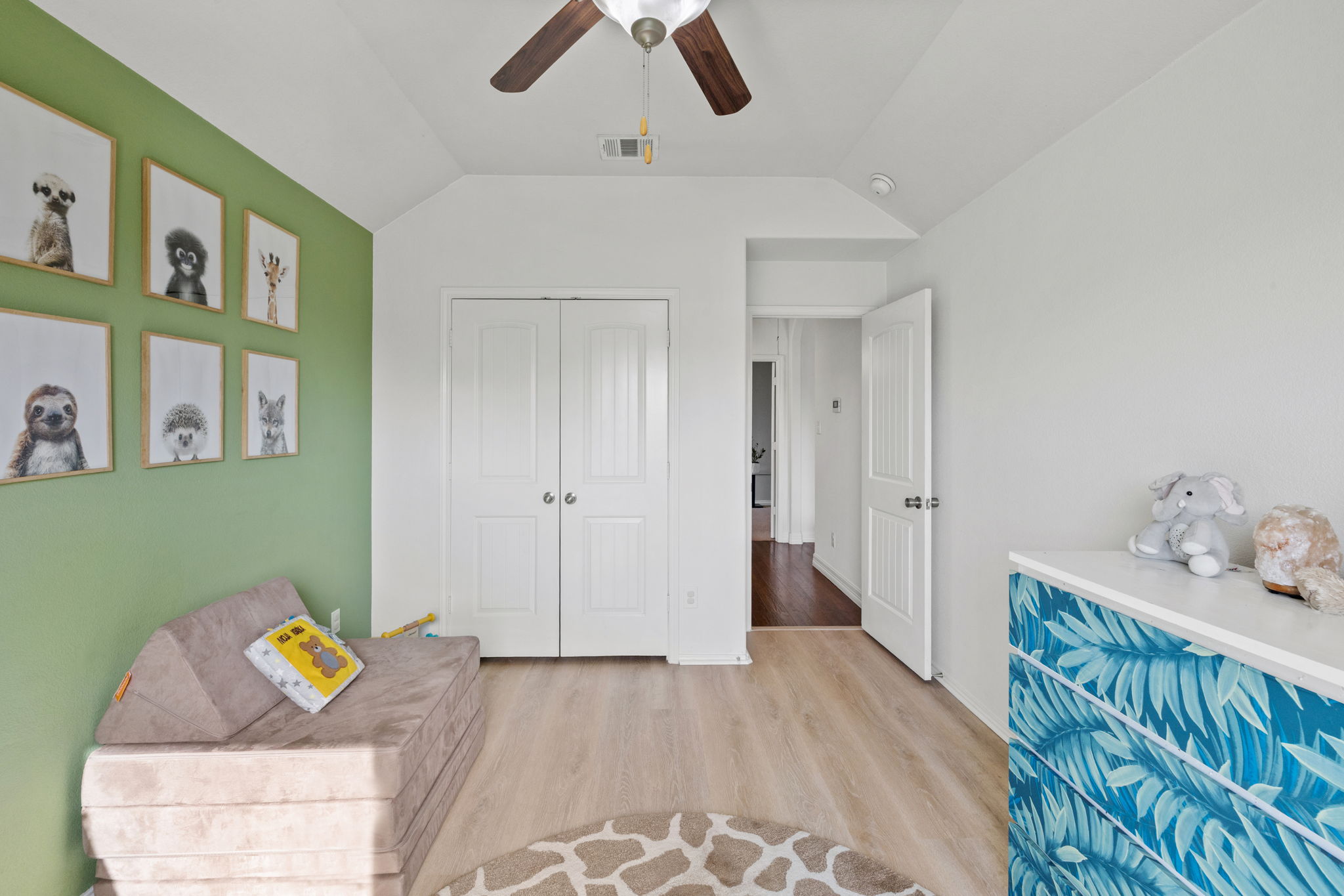 482 Travertine Trail Buda, TX 78610 - Photo 11 of 40 a bedroom with furniture and a chandelier fan