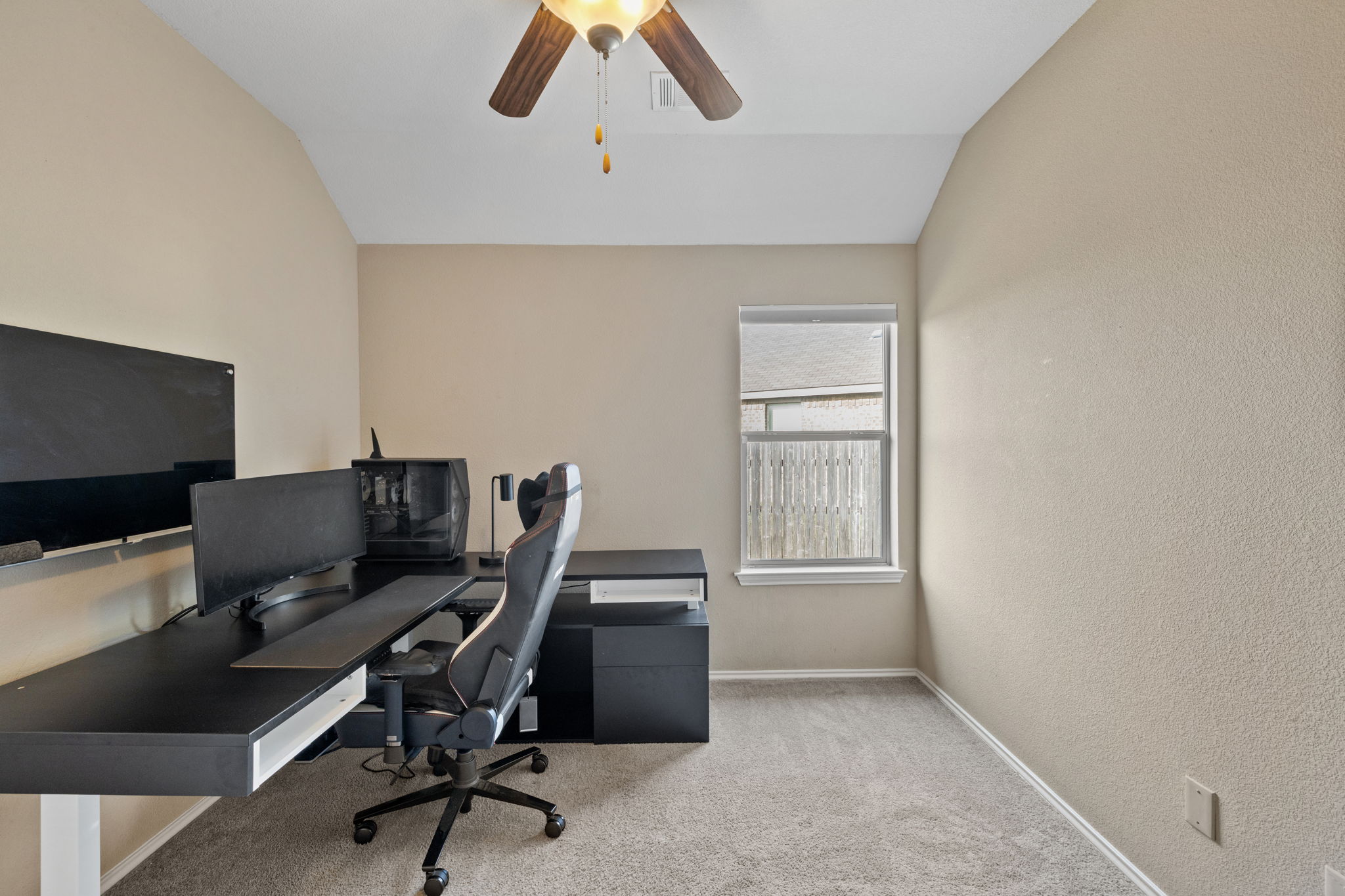 482 Travertine Trail Buda, TX 78610 - Photo 15 of 40 a view of a workspace with furniture and a window