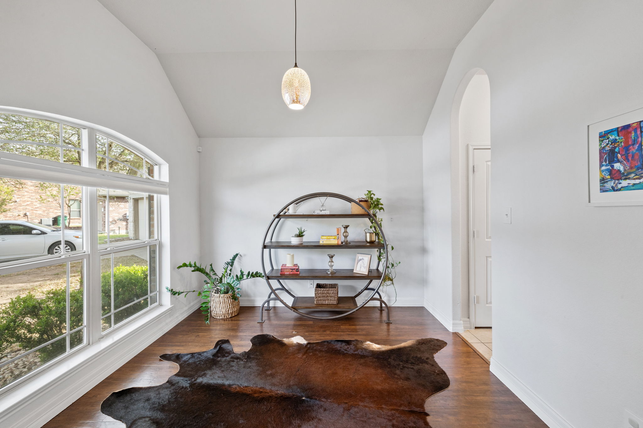 482 Travertine Trail Buda, TX 78610 - Photo 17 of 40 a room with furniture and a large window