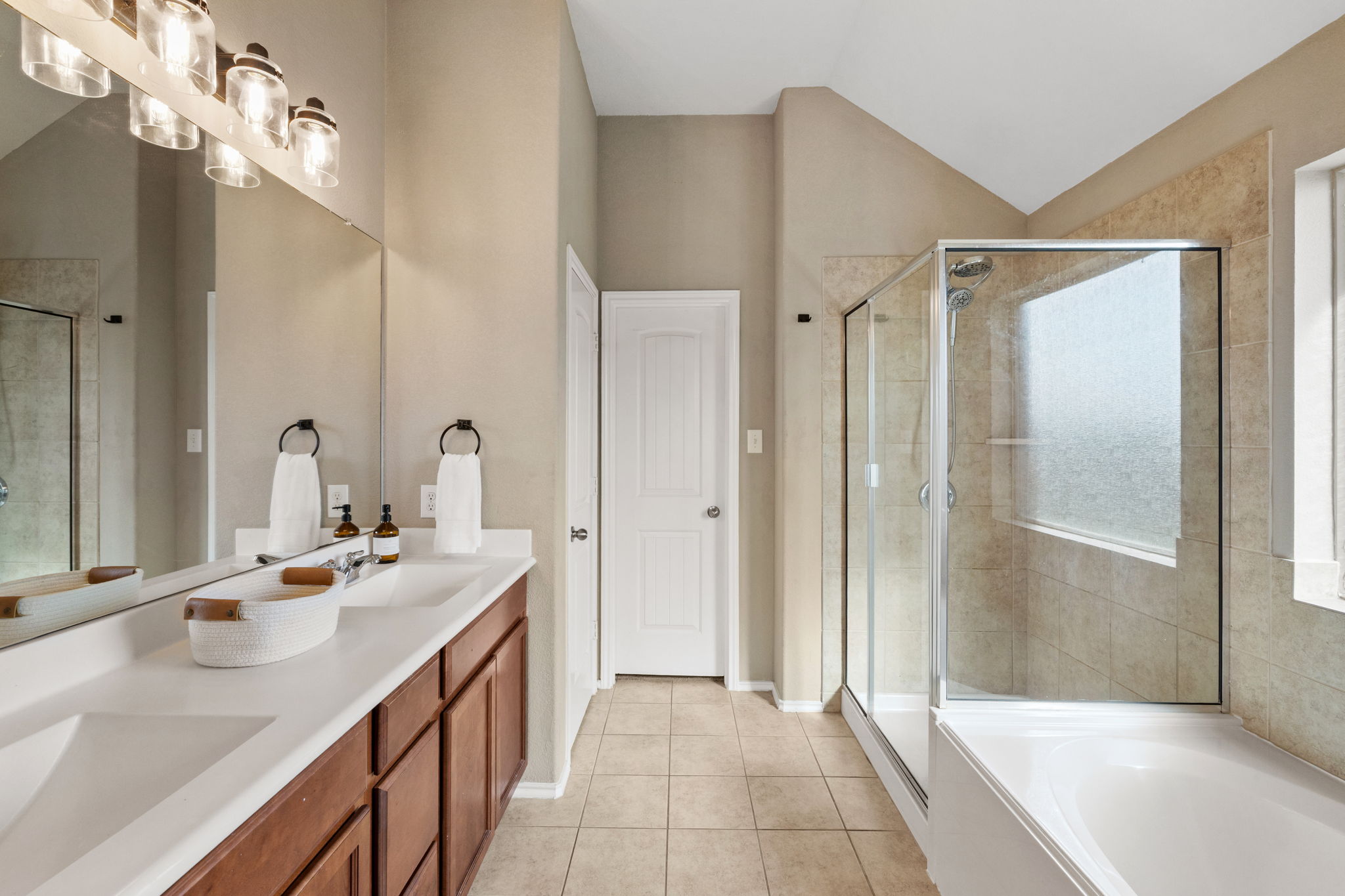 482 Travertine Trail Buda, TX 78610 - Photo 22 of 40 a bathroom with a double vanity sink mirror and shower