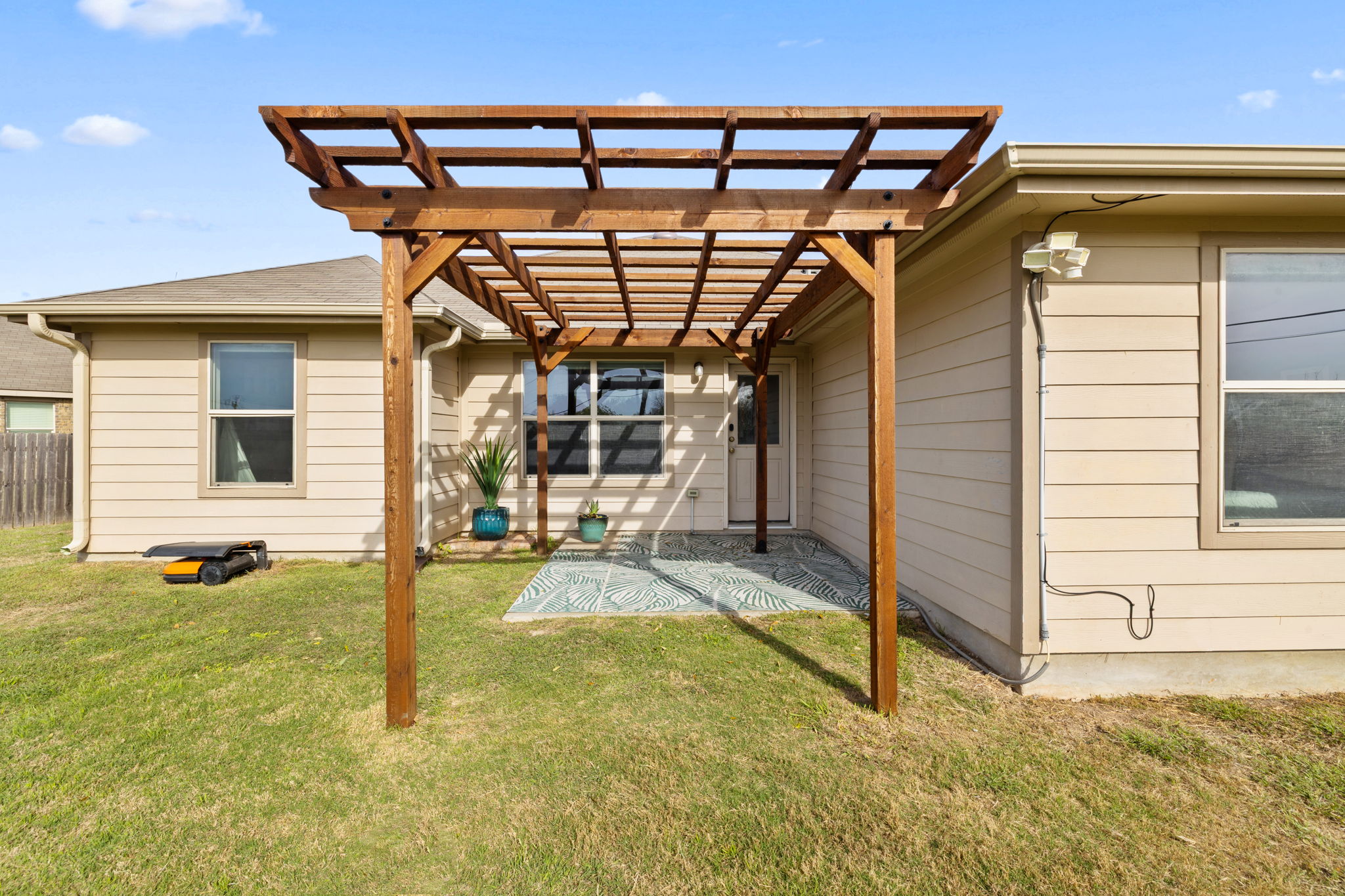 482 Travertine Trail Buda, TX 78610 - Photo 27 of 40 a view of a porch with yard and wooden floor
