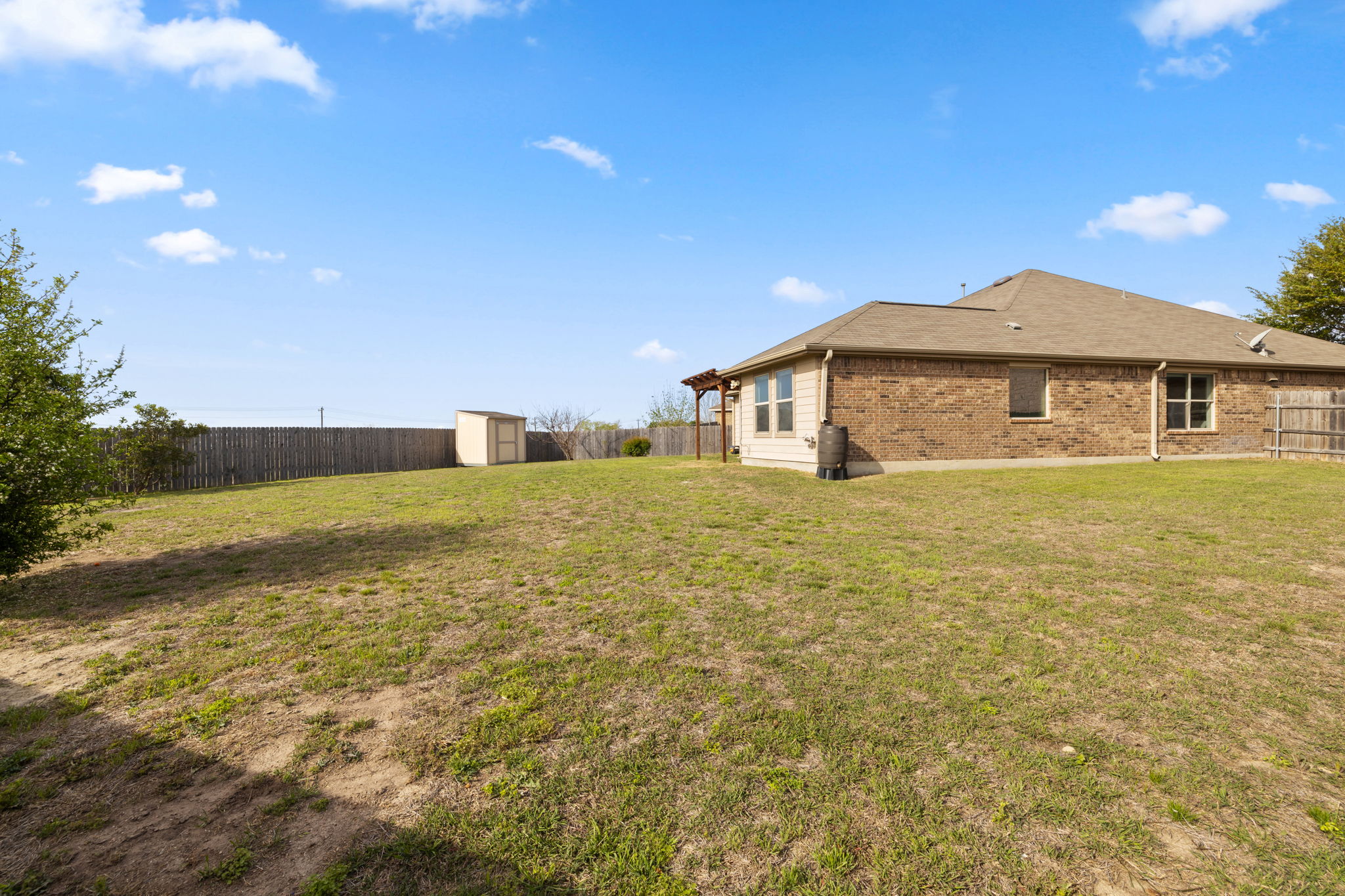 482 Travertine Trail Buda, TX 78610 - Photo 28 of 40 a view of a house with a yard