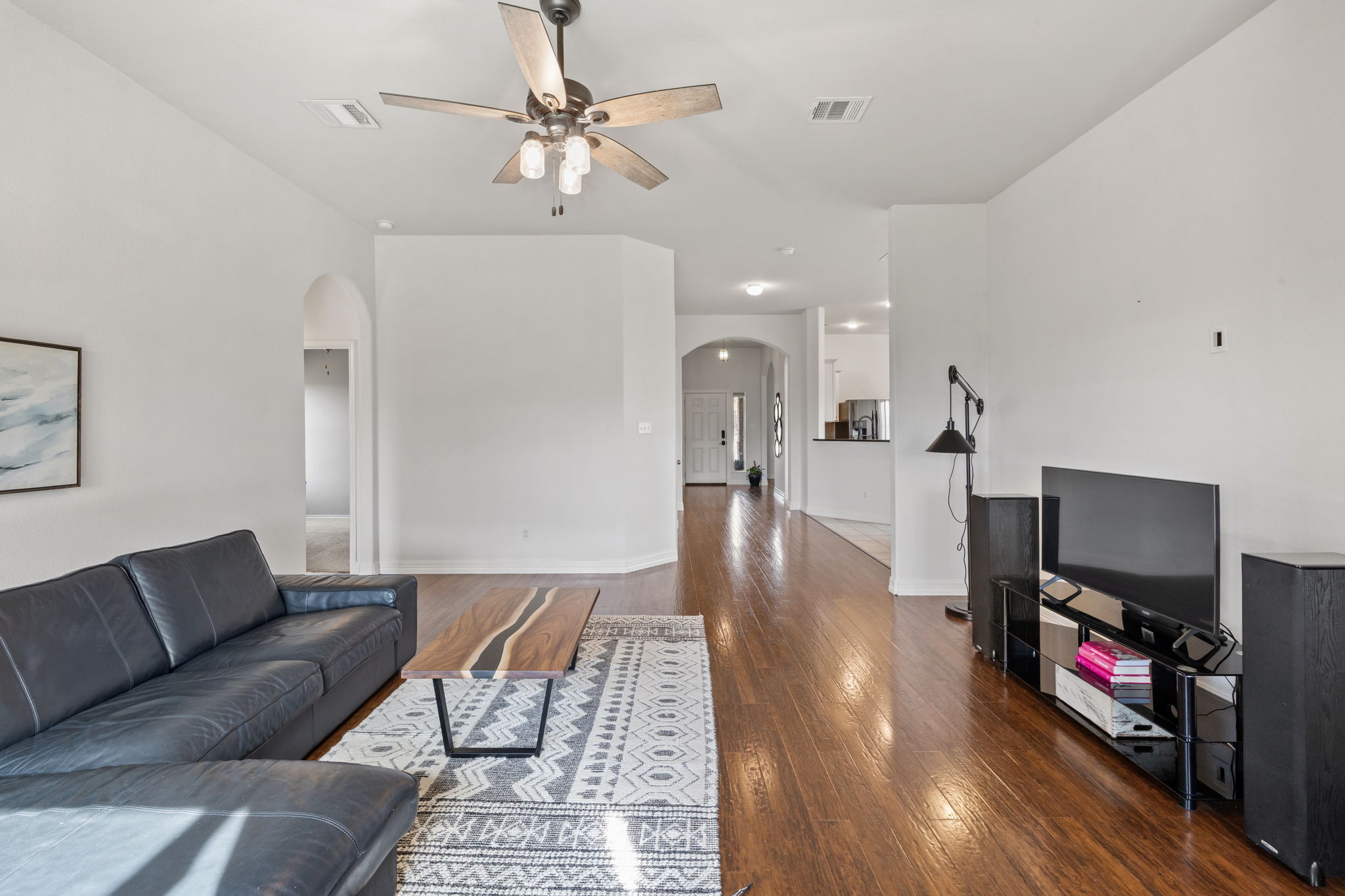 482 Travertine Trail Buda, TX 78610 - Photo 9 of 40 a living room with furniture and a flat screen tv
