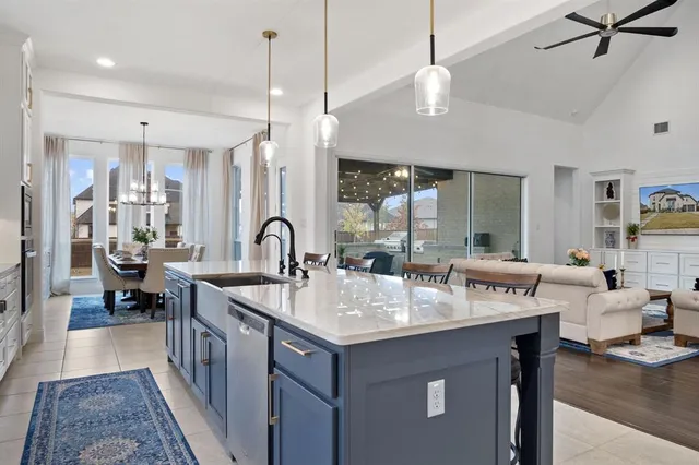 a view of living room with granite countertop furniture and chandelier