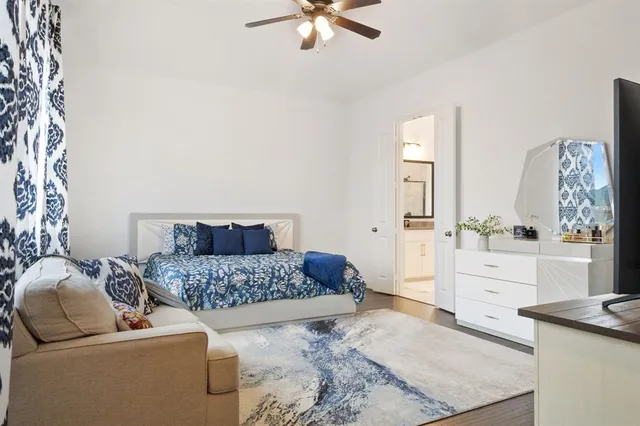 a living room with furniture and a dresser