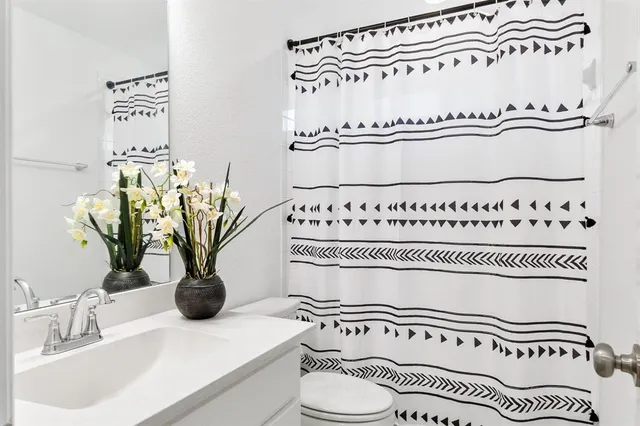 a bathroom with a bathtub and a sink