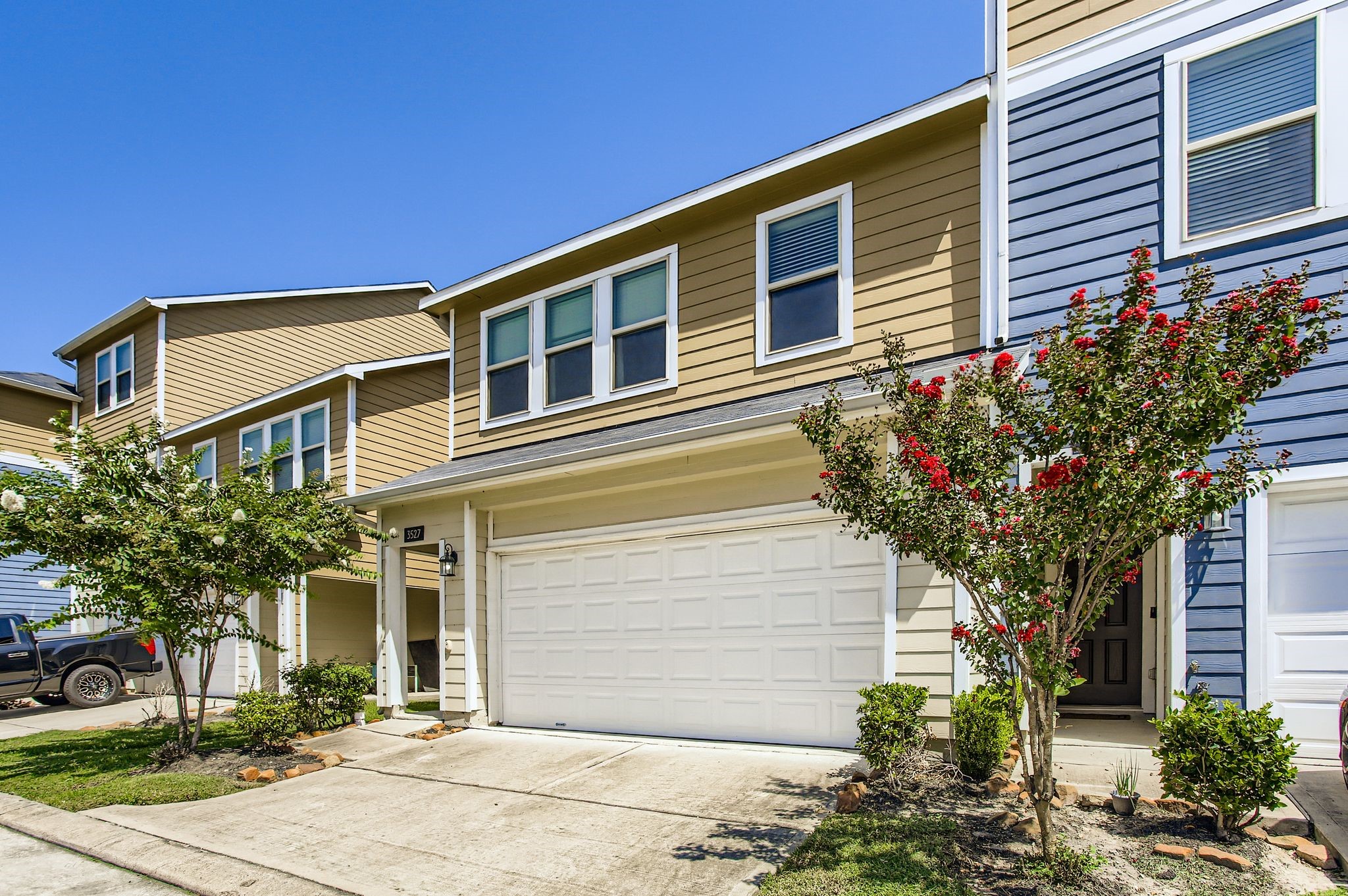 a front view of a house with a yard