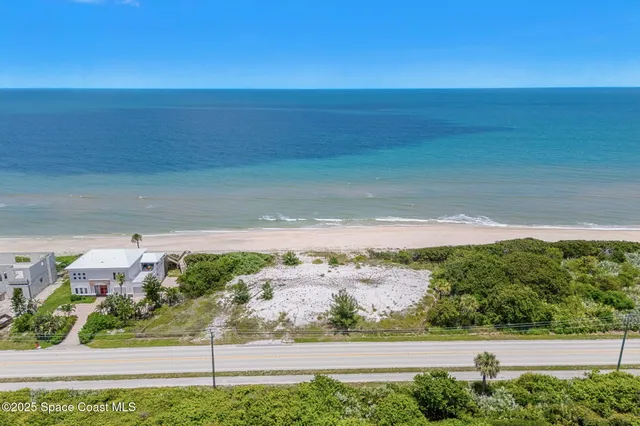 a view of a yard with an ocean view