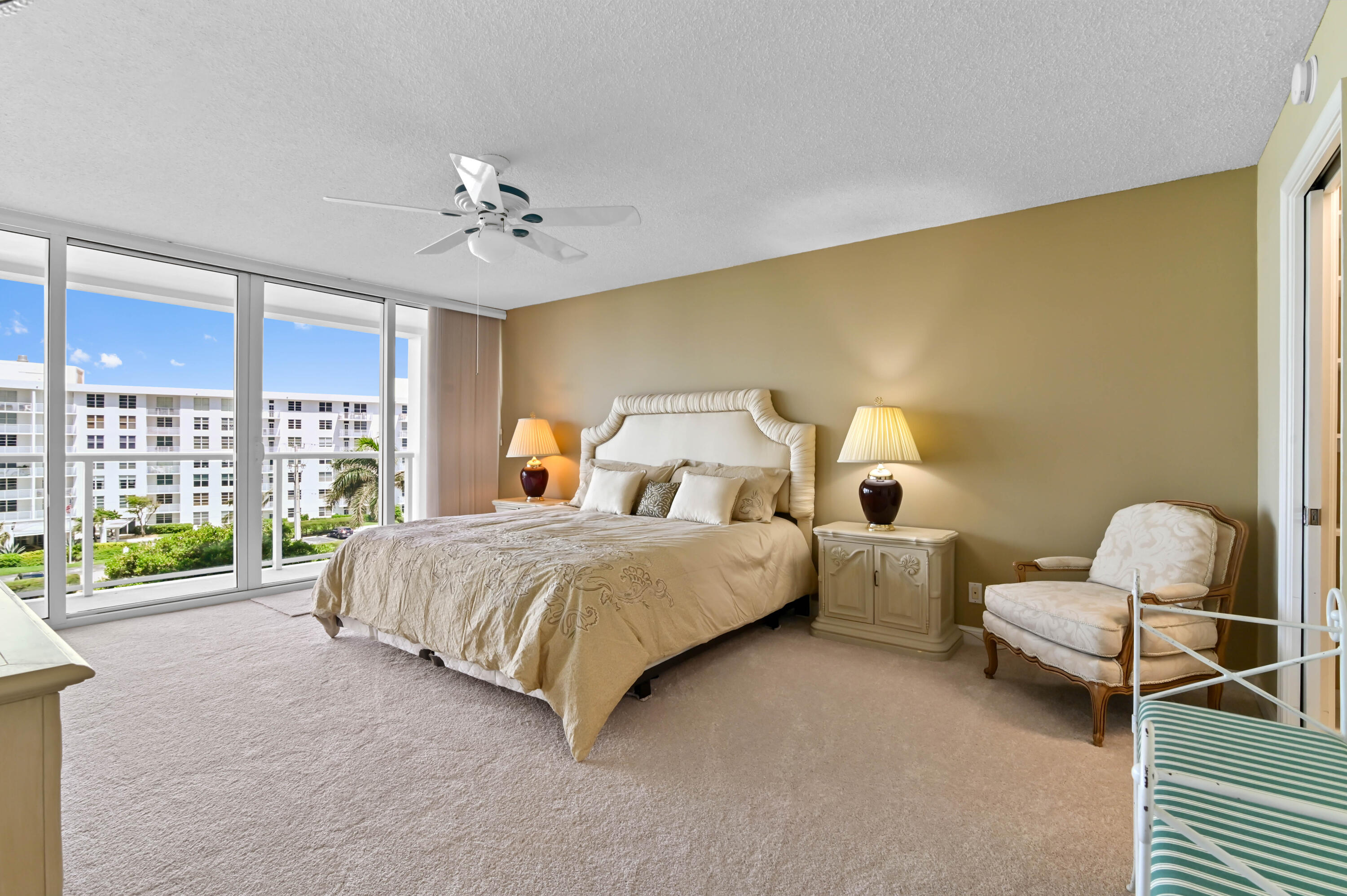 2800 South Ocean Boulevard, Unit 5J Boca Raton, FL 33432 - Photo 15 of 56 a spacious bedroom with a bed and large windows