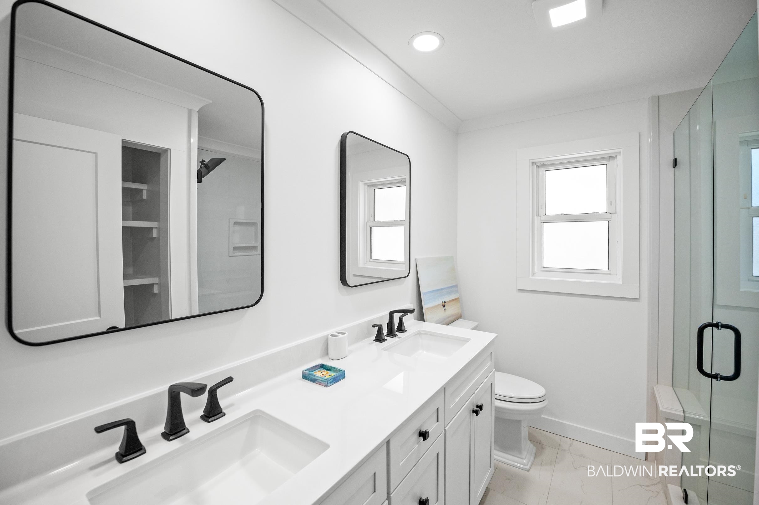 9459 Soldier Creek Road Lillian, AL 36549 - Photo 23 of 54 Full bath with marble finish floor, a shower stall, ornamental molding, and a sink