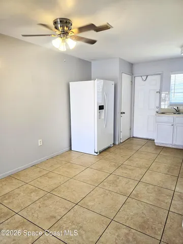 a kitchen with stainless steel appliances a refrigerator sink and cabinets