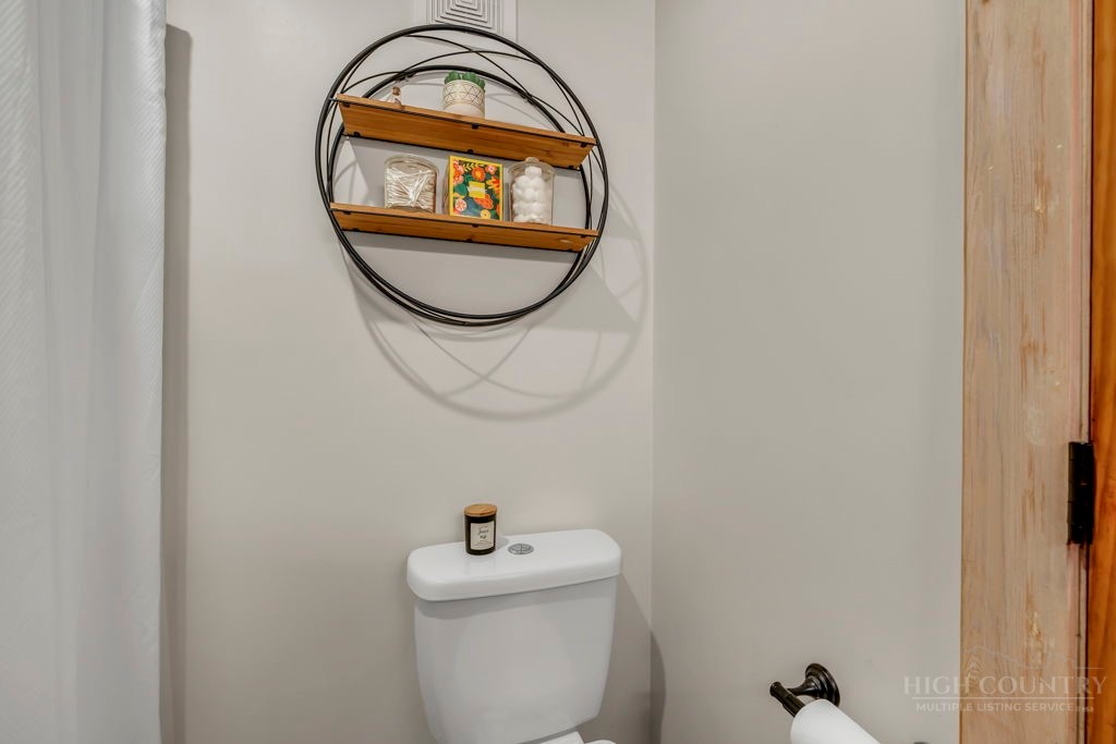 192 Dewitt Barnett Road Vilas, NC 28692 - Photo 16 of 32 a bathroom with a toilet and a sink