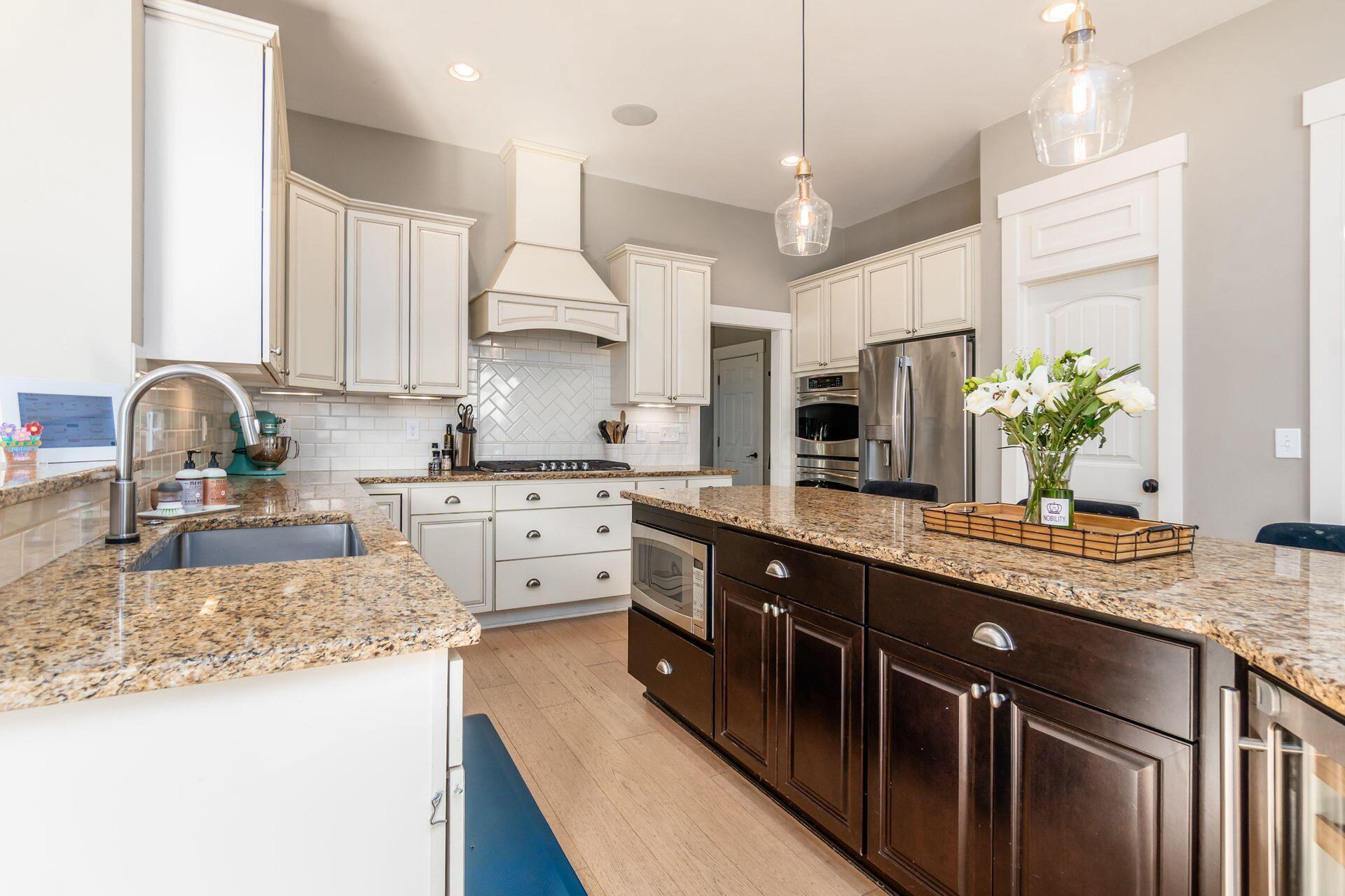 1002 Rambling Brook Way Delaware, OH 43015 - Photo 25 of 104 Spacious kitchen with center island, stainless steel appliances including gas range and double oven, built in microwave, beverage refrigerator, walk-in pantry and sunny breakfast room.